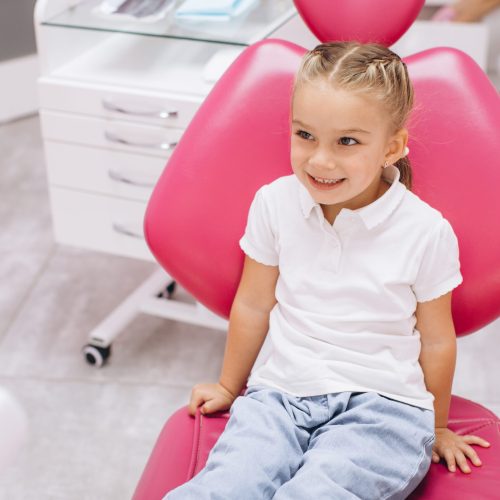 Little girl smiling on a visit to the dentist at the dental clinic